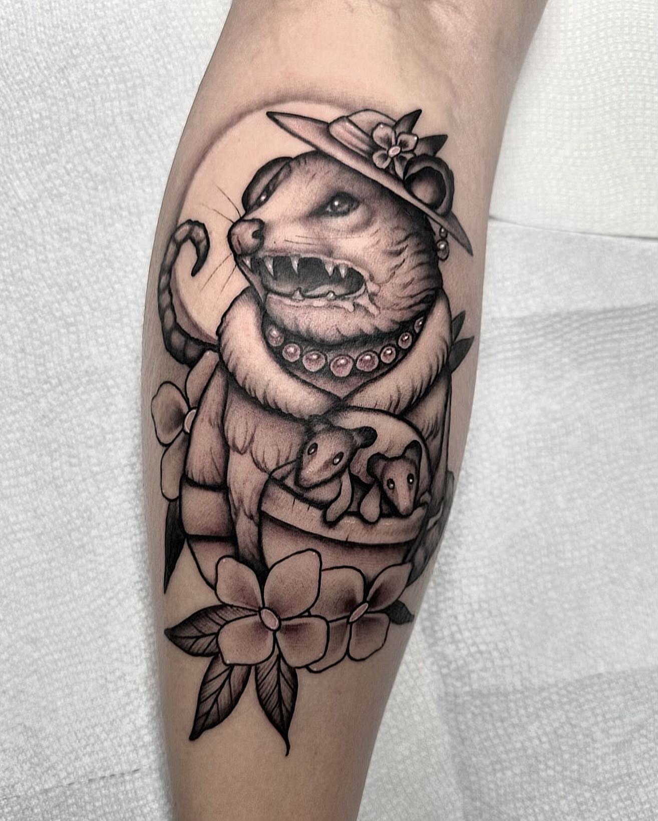 Otter with kittens American traditional tattoo on the forearm by Lawrence Edwards