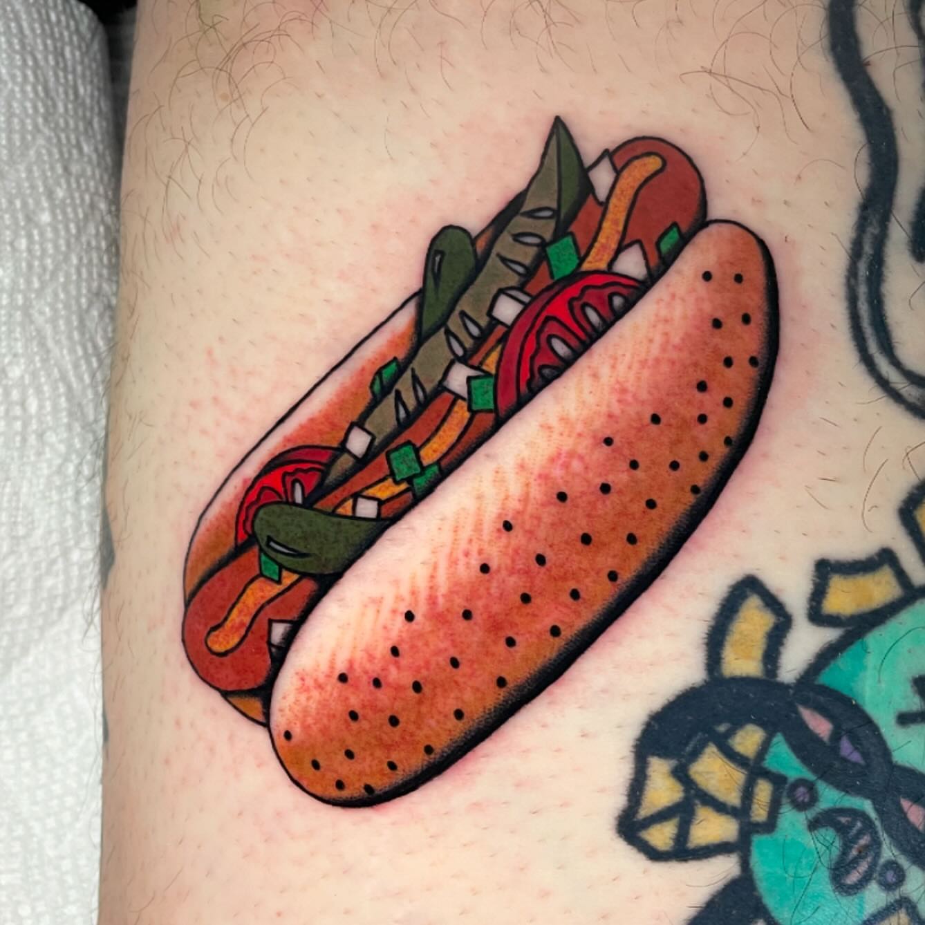 Hot dog dotwork tattoo on the forearm by Toulouse Noble, Portland, Oregon
