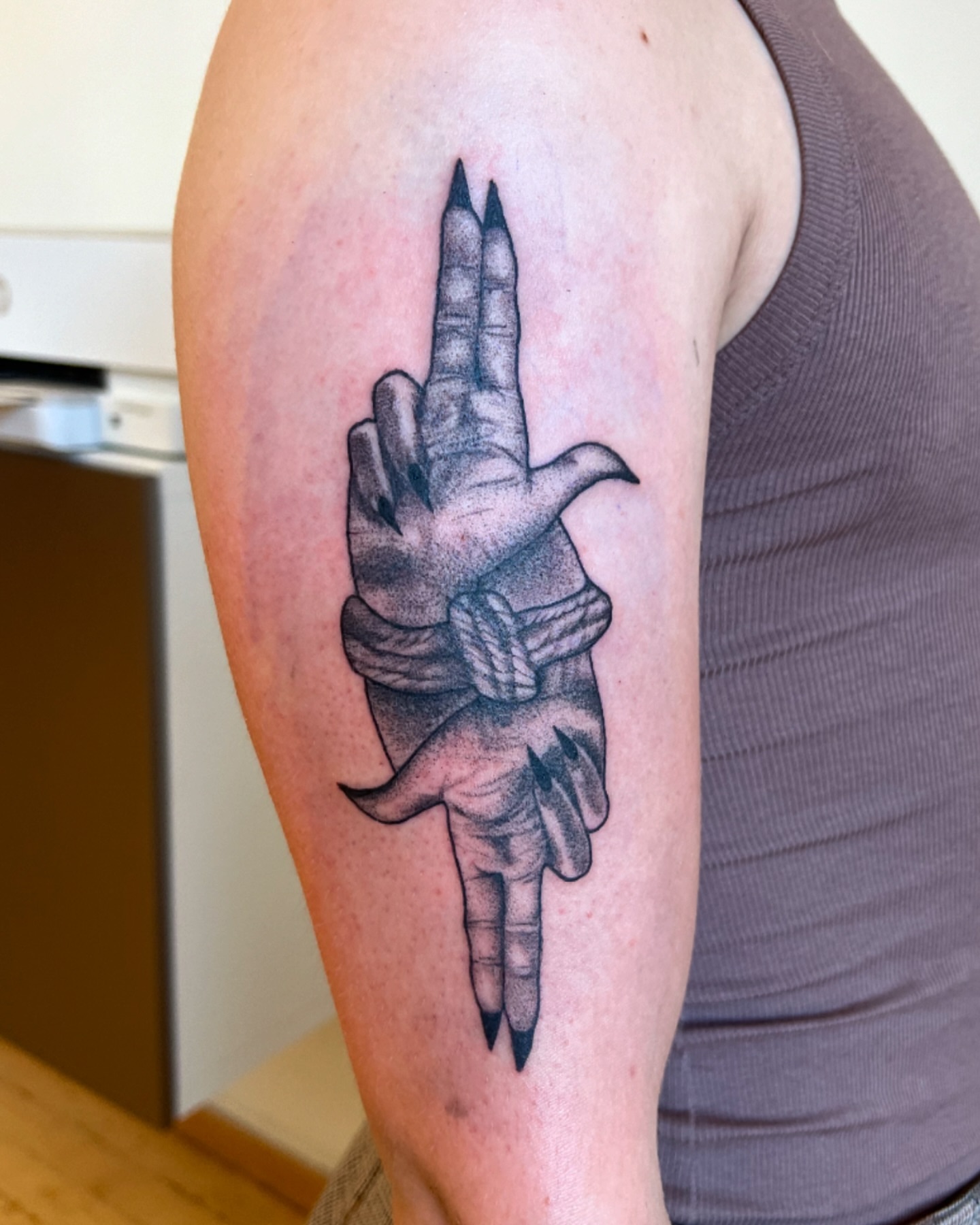 Hand with string dotwork tattoo on the forearm by Maddy Paige
