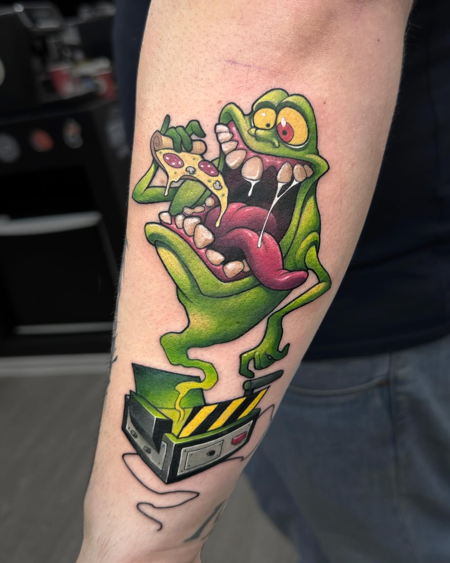 Green ghost American traditional tattoo on the forearm by Lena Aleksandrova