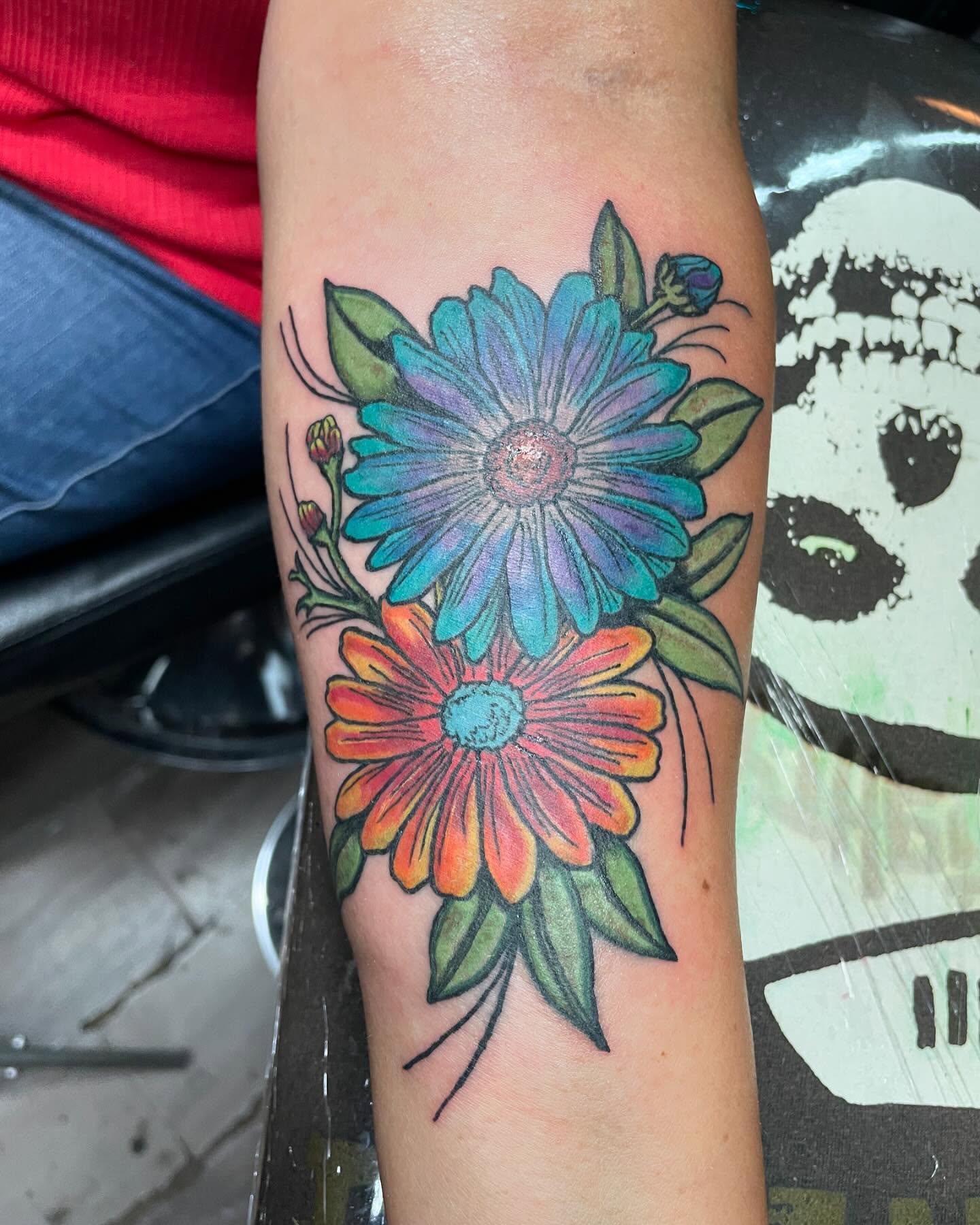 Daisies new school tattoo on the forearm by Mark Johnson [Tattoo Artist]