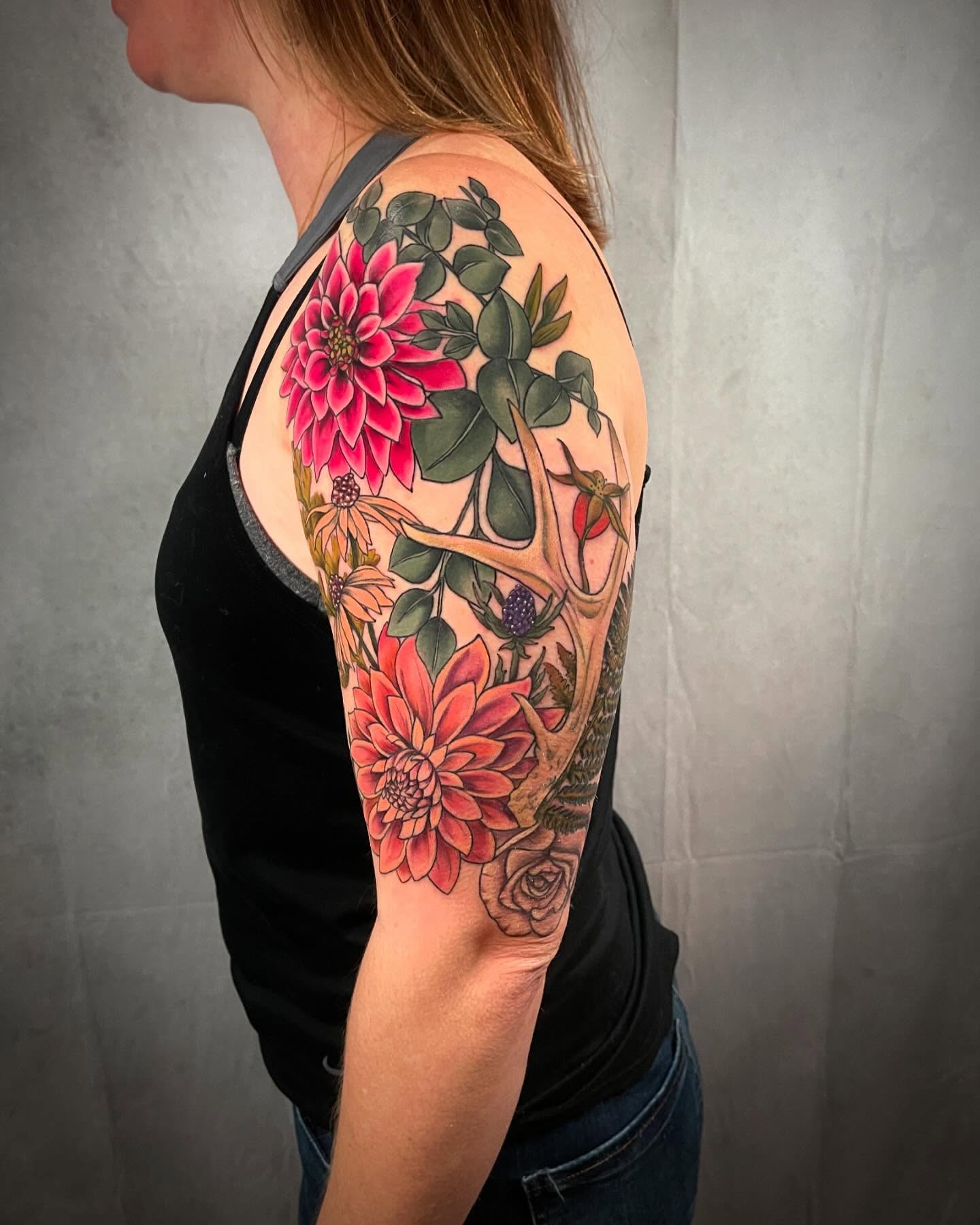 Floral arrangement realism tattoo on the upper arm by 𝓚𝓪𝓼𝓼𝓪𝓷𝓭𝓻𝓪 𝓜𝓬𝓒𝓪𝓵𝓵, Eugene, Oregon