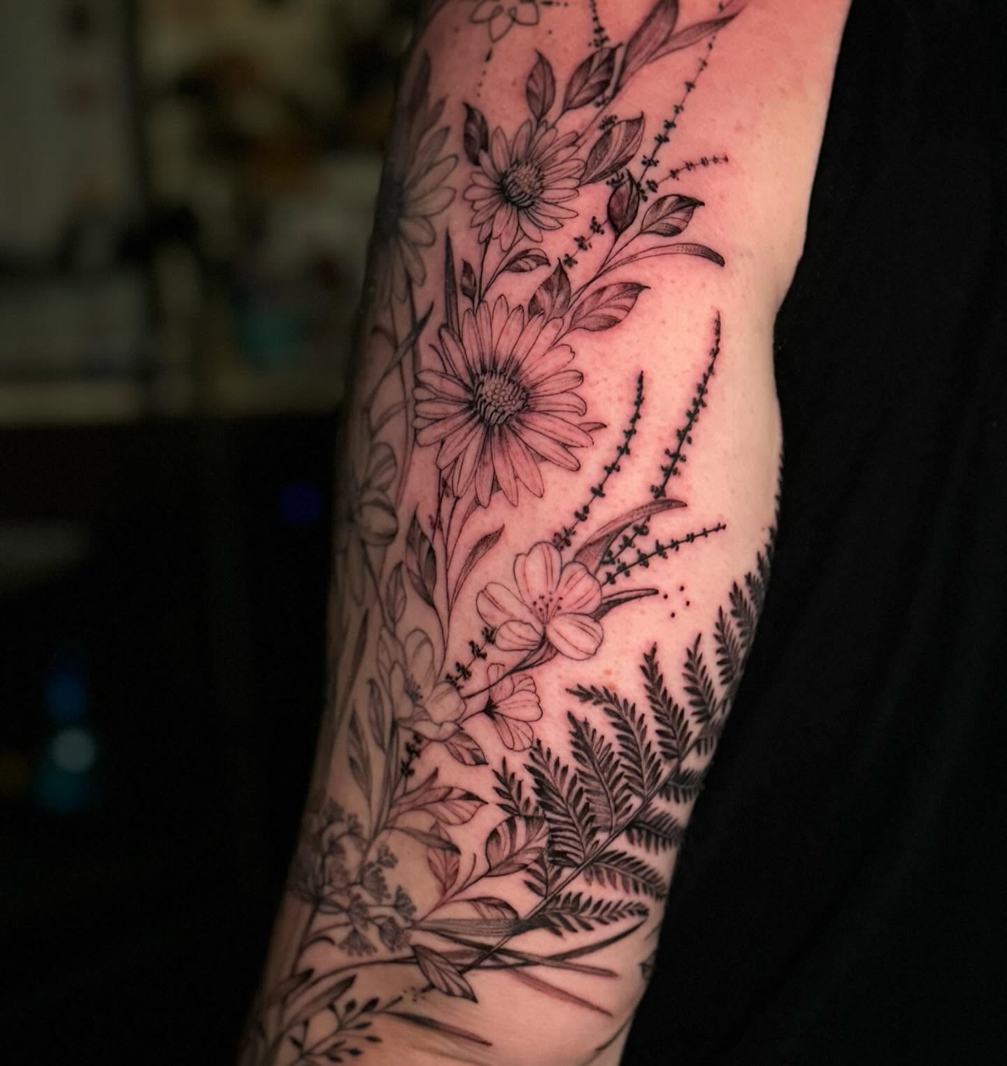 Floral bouquet black and grey tattoo on the forearm by đź’›Kristinađź’› tattoos with intention, Minneapolis, Minnesota