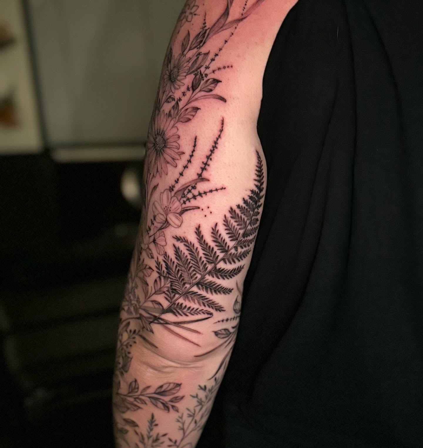 Floral arrangement black and grey tattoo on the forearm by đź’›Kristinađź’› tattoos with intention, Minneapolis, Minnesota