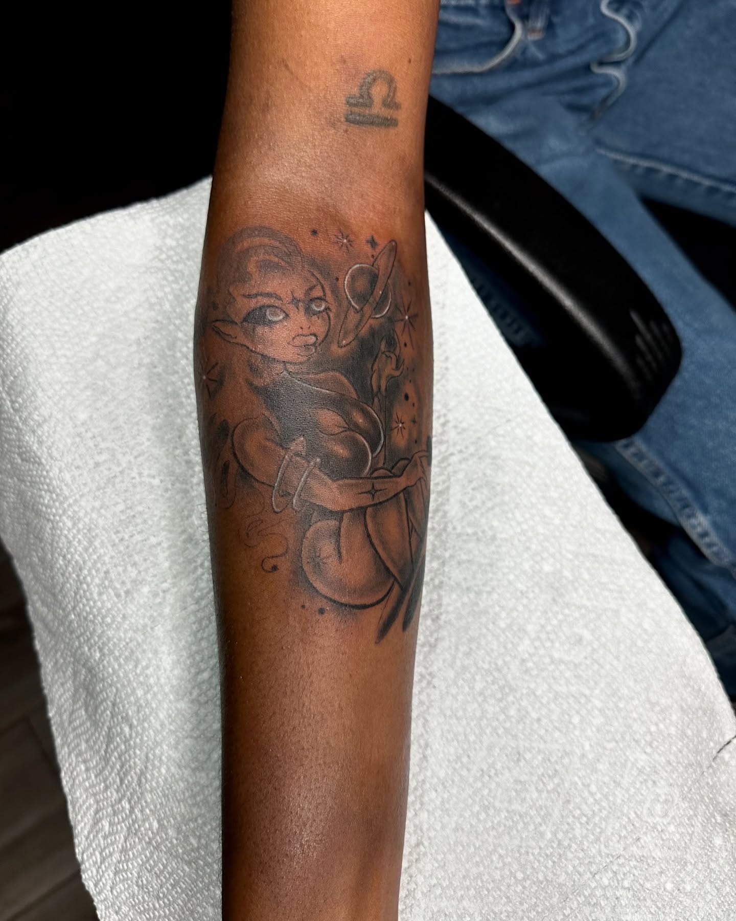 Astronaut black and grey tattoo on the forearm by Mia Layne 🤎