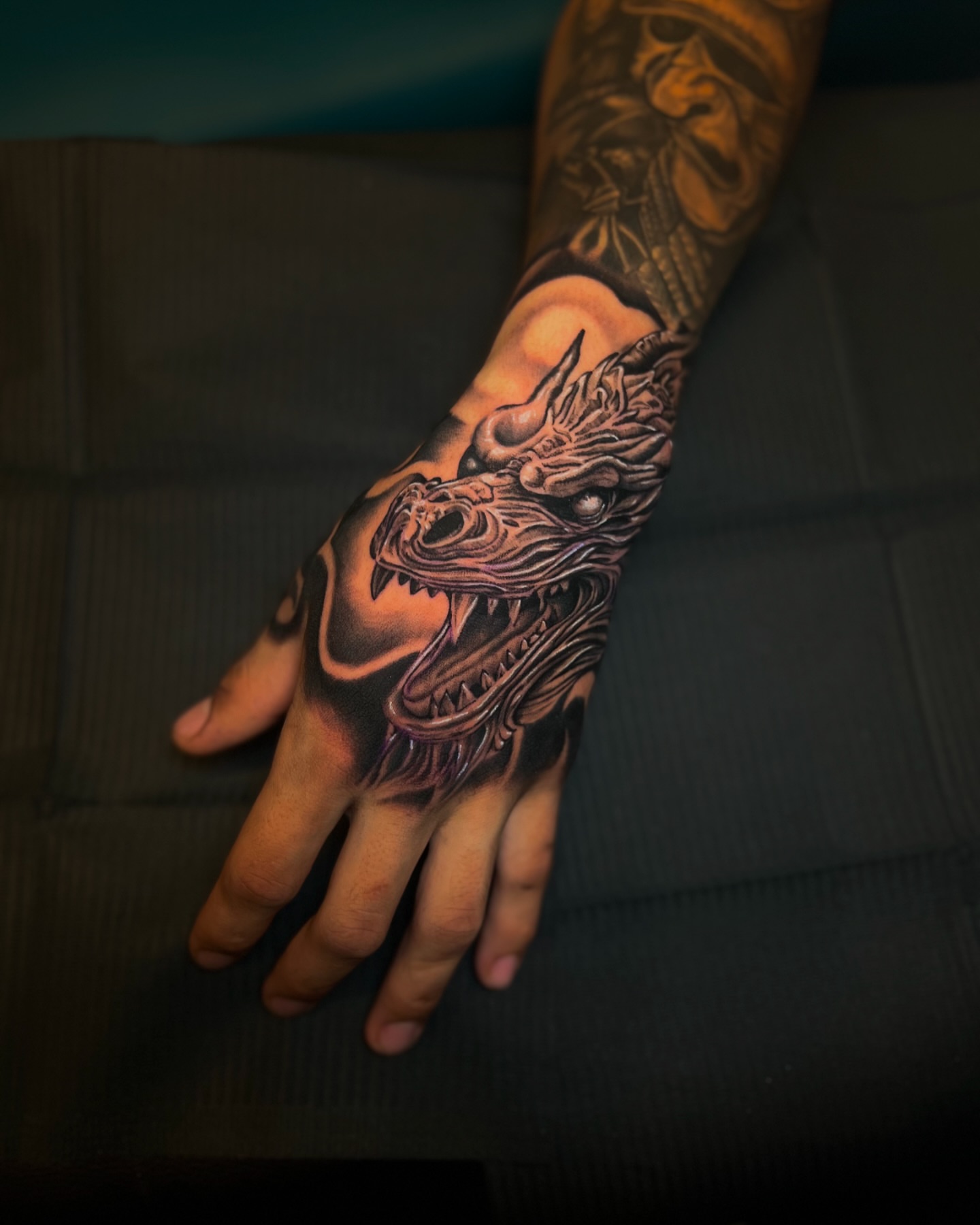 Dragon realism tattoo on the hand by Sebastian Calderon