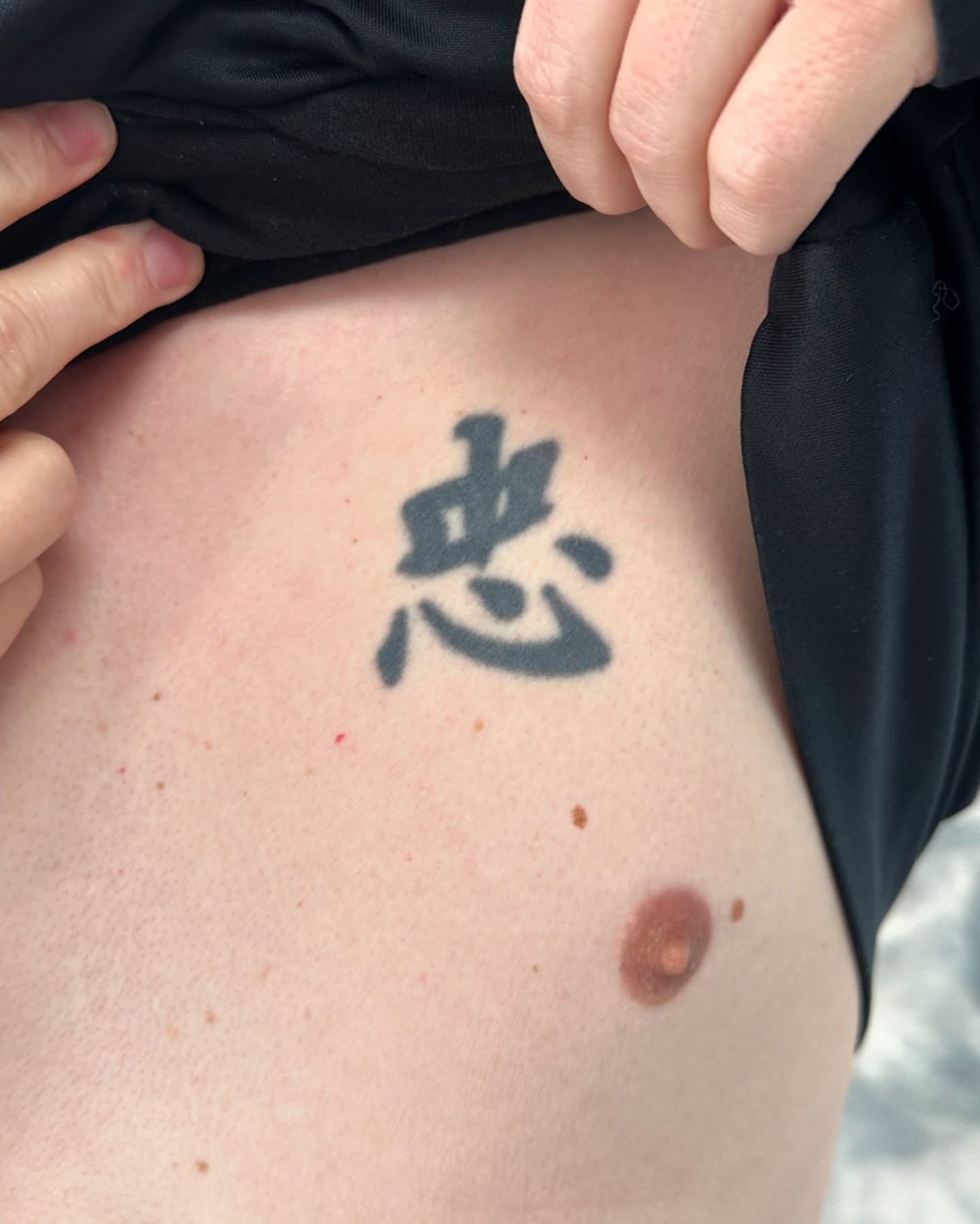 Kanji character black and grey tattoo on the torso by Winters Ashurst - St. George tattoo artist