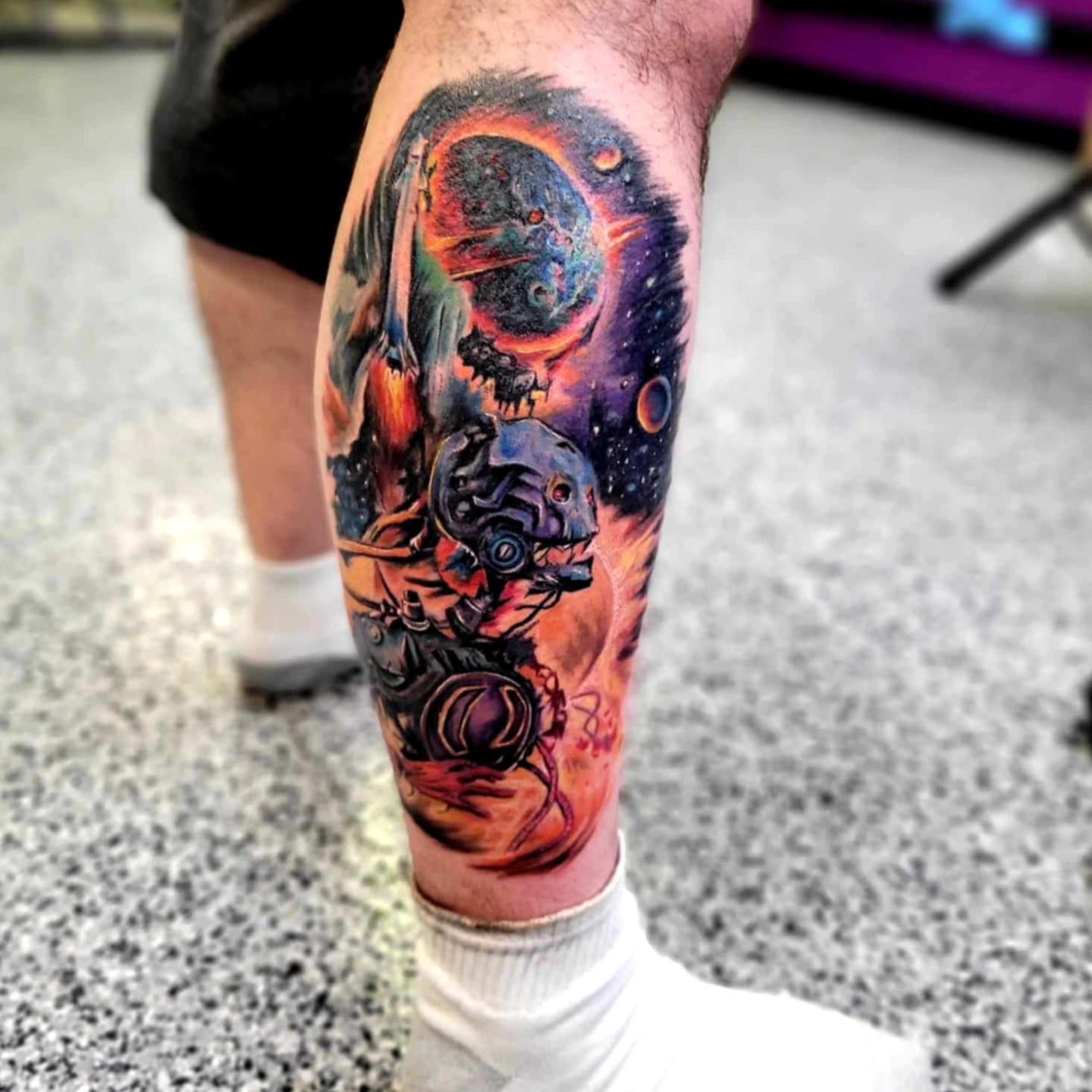 Astronaut in space realism tattoo on the calf by Drew King
