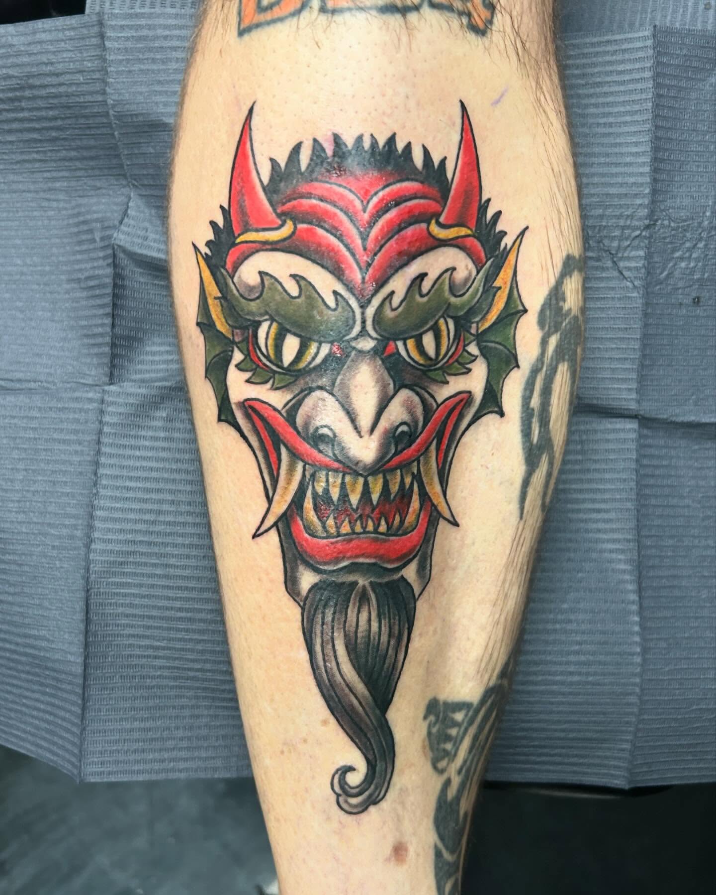 Demon mask American traditional tattoo on the forearm by B Hendrix, Cuyahoga Falls, Ohio