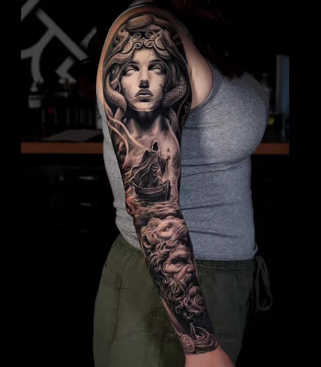 Medusa and Charon in a boat realism tattoo on the forearm by Brandon Rabago, Fort Worth, Texas