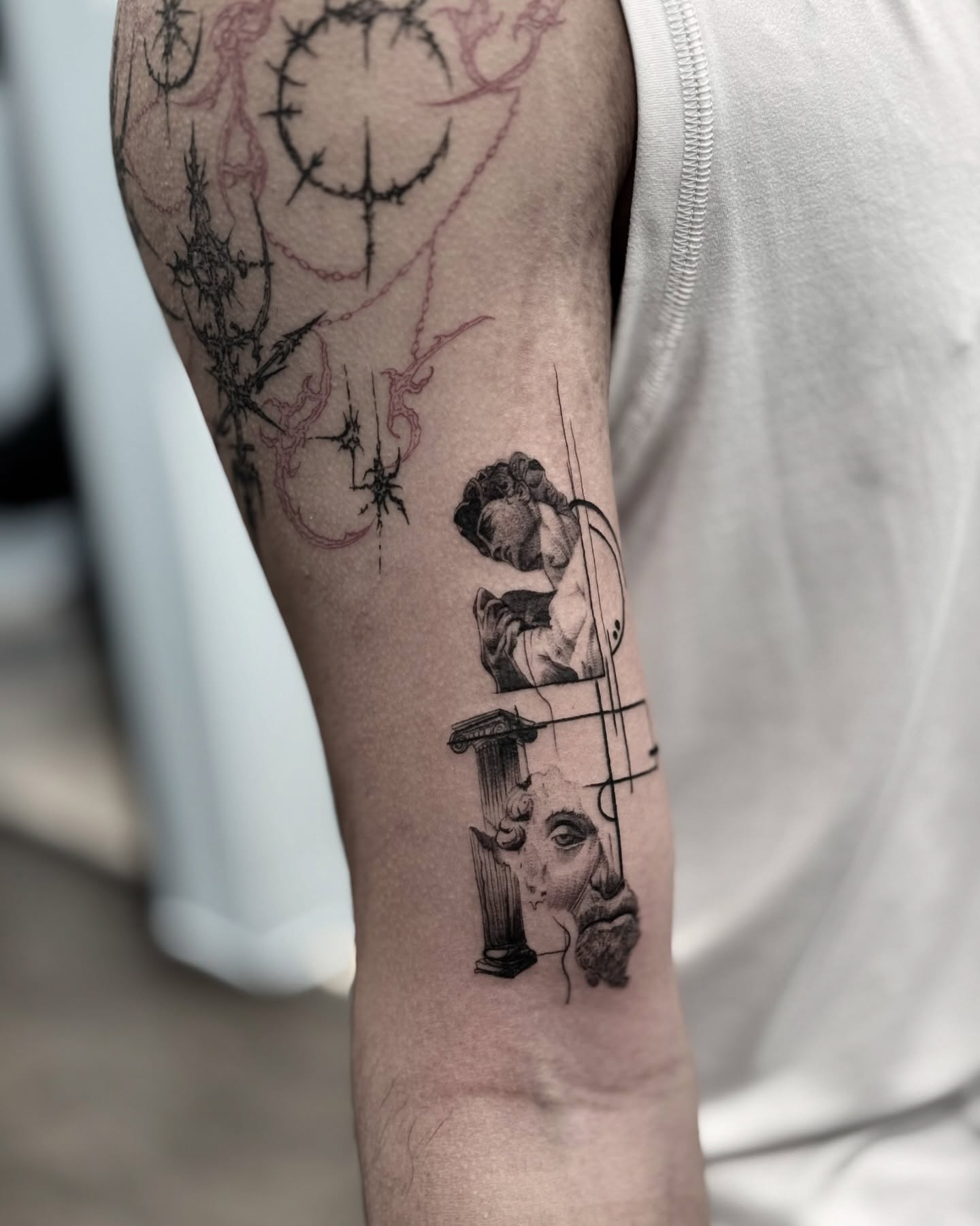 Statue and cherub realism tattoo on the forearm by Kbtattz