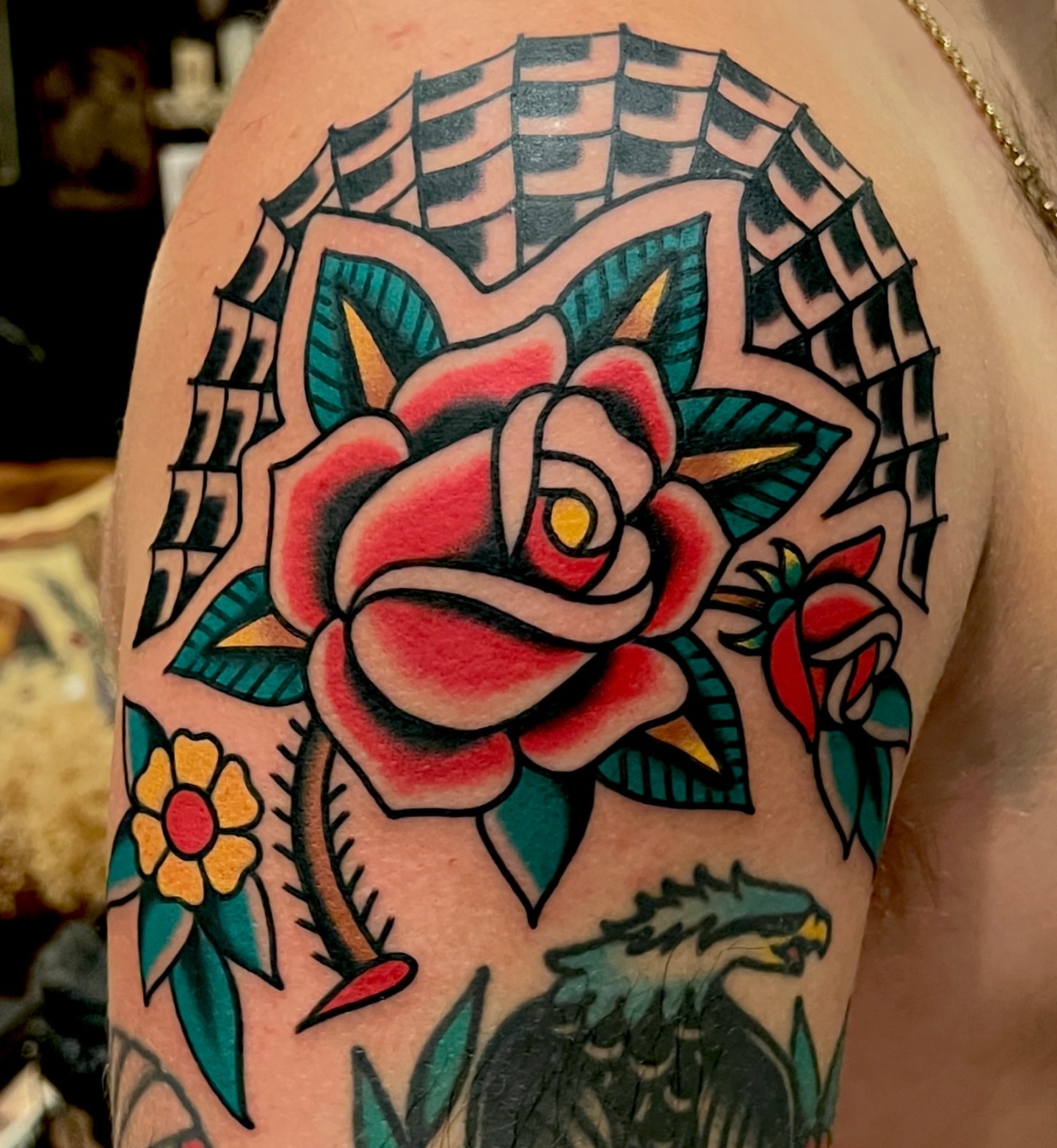 Rose American traditional tattoo on the shoulder by Ian Jett