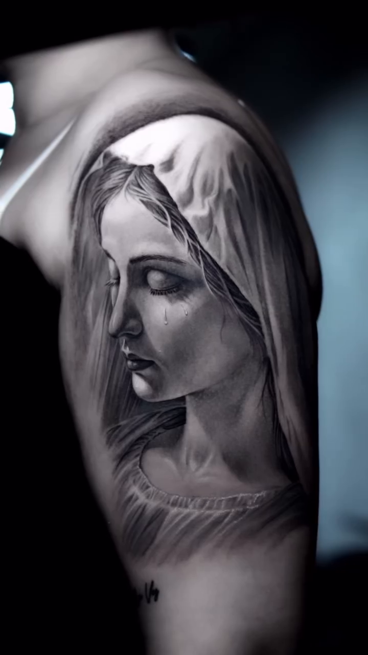 Woman's portrait realism tattoo by Luis Bravo