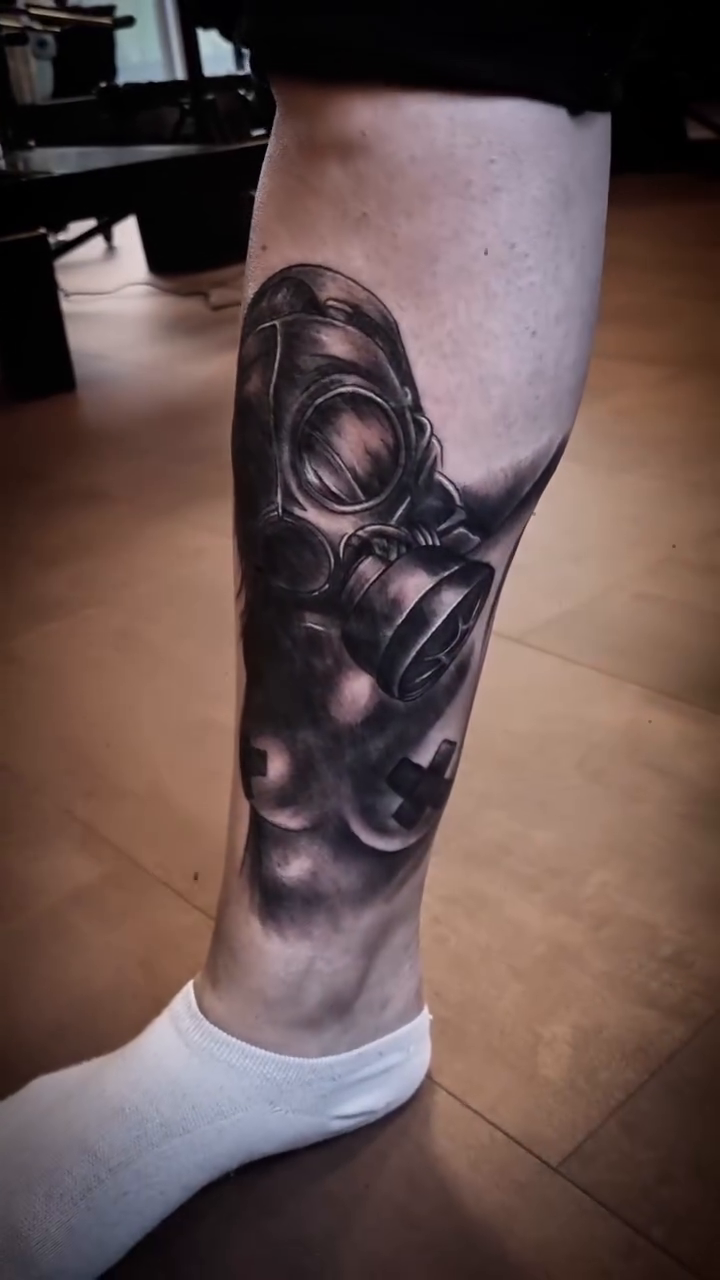 Gas mask realism tattoo by AntiheroTattoo