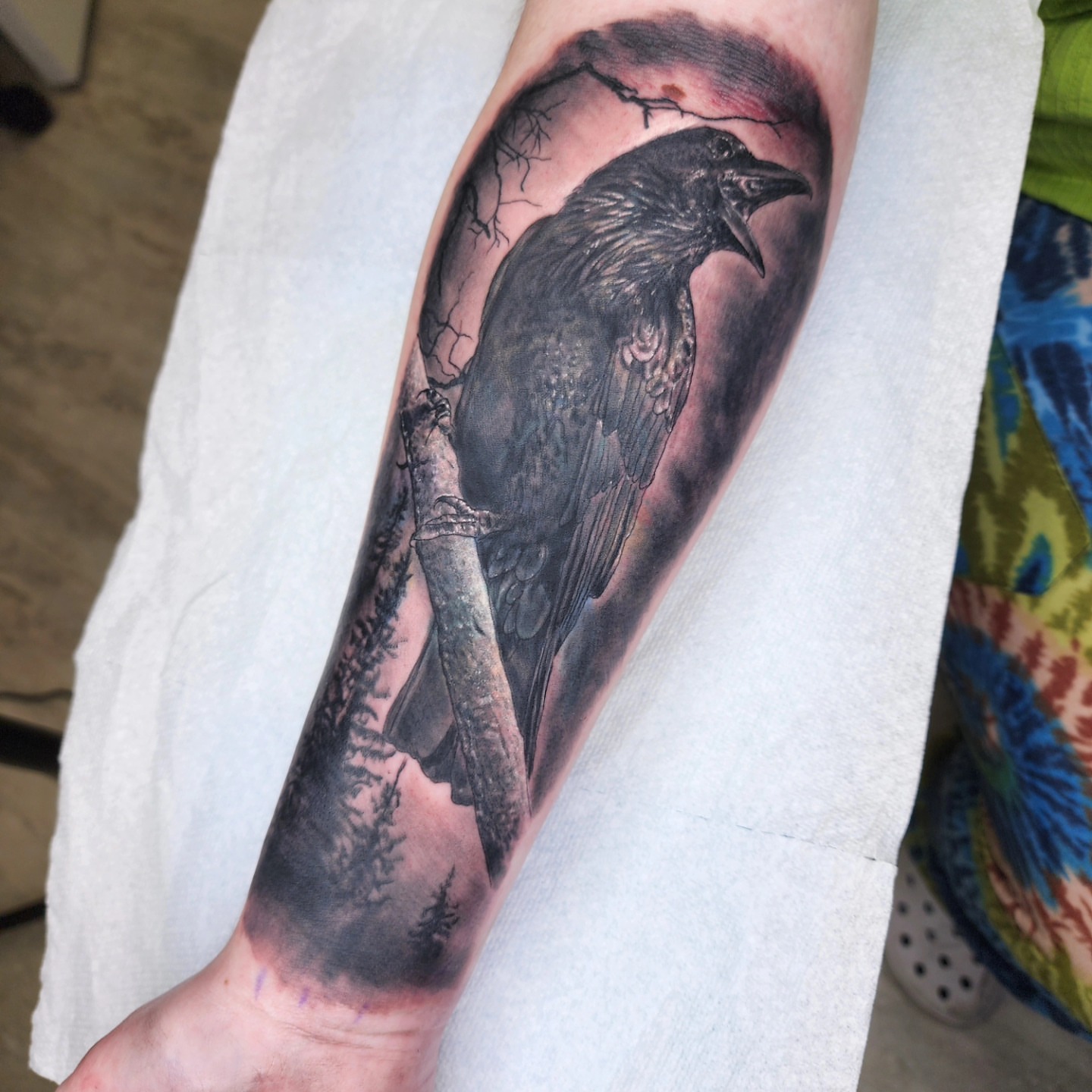 Crow realism tattoo on the forearm by Zach Mullins