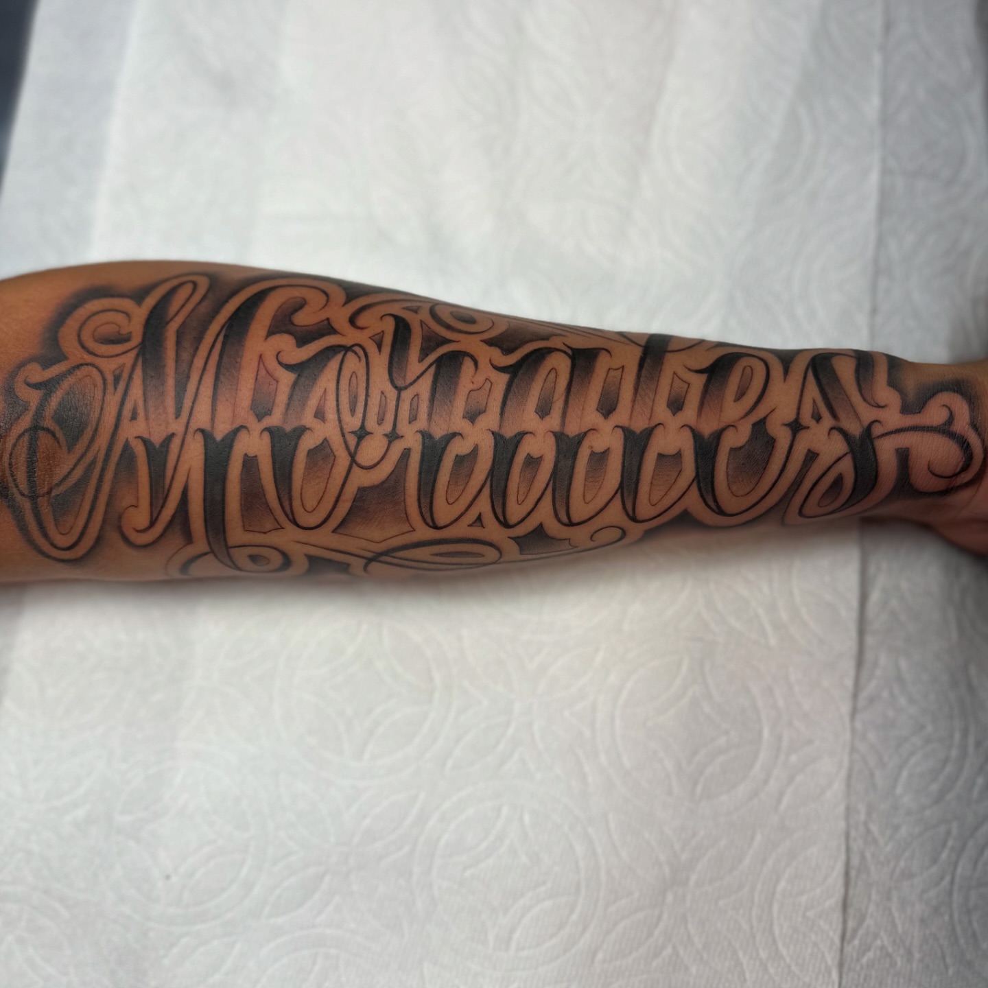 Script lettering lettering script tattoo on the forearm by Yari, Los Angeles, California