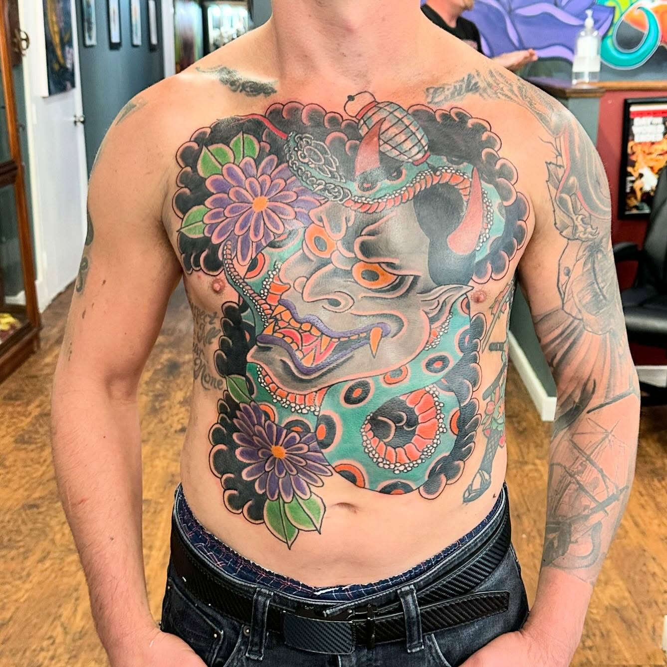 Demon mask with flowers japanese irezumi tattoo on the chest by Jackie