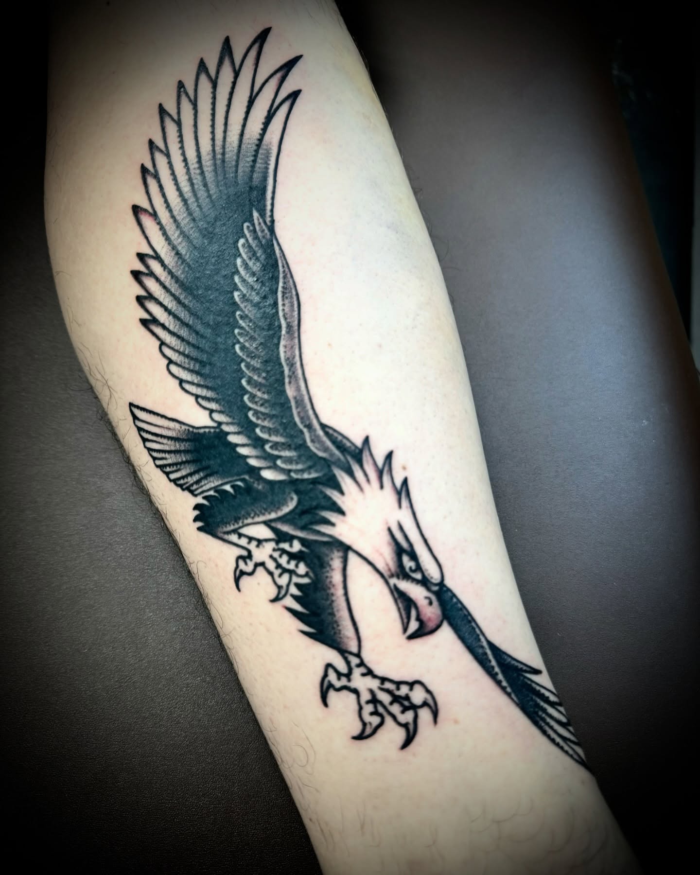 Eagle black and grey tattoo on the forearm by Kristen