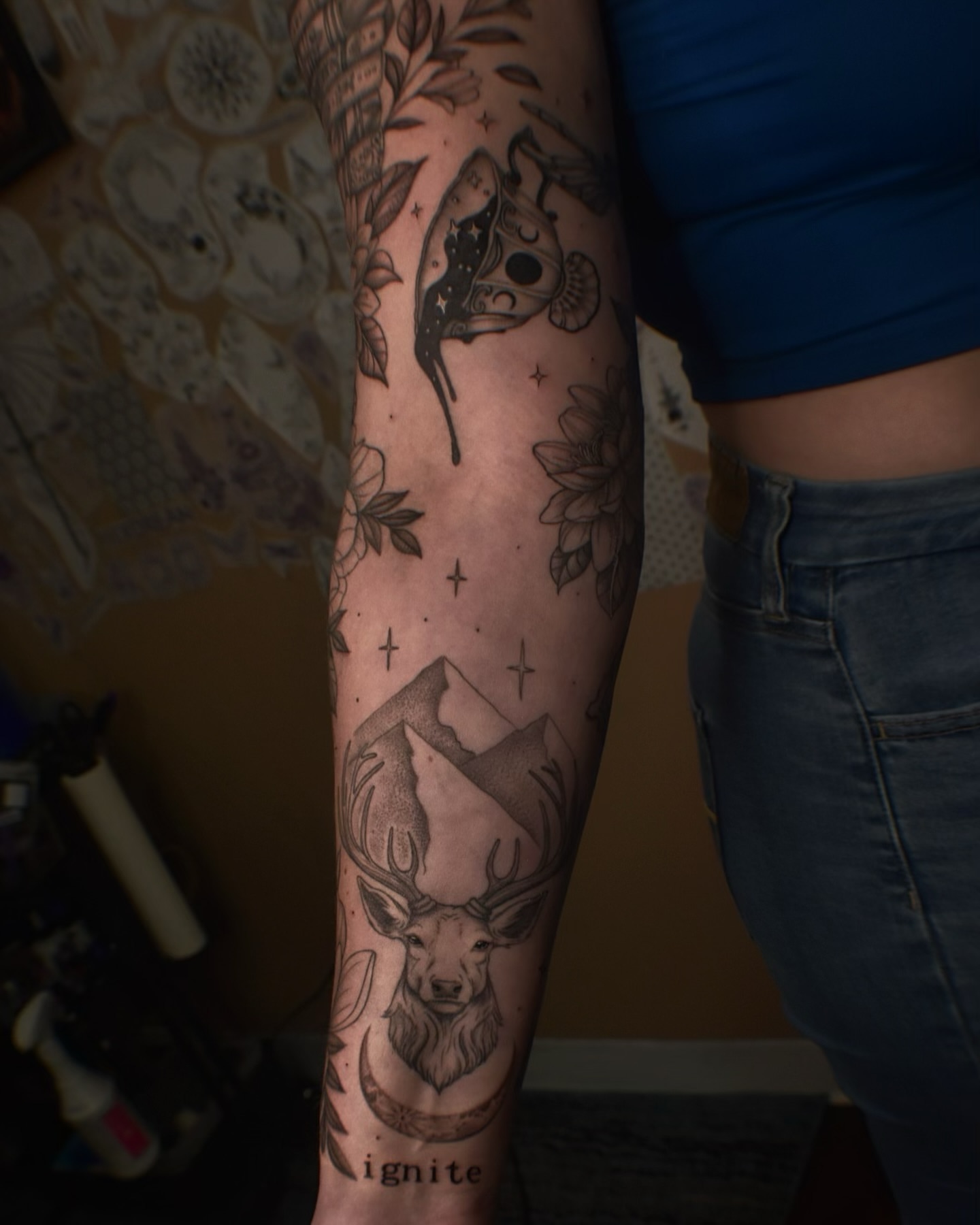 Deer and mountain dotwork tattoo on the forearm by Alexandria Gudiel