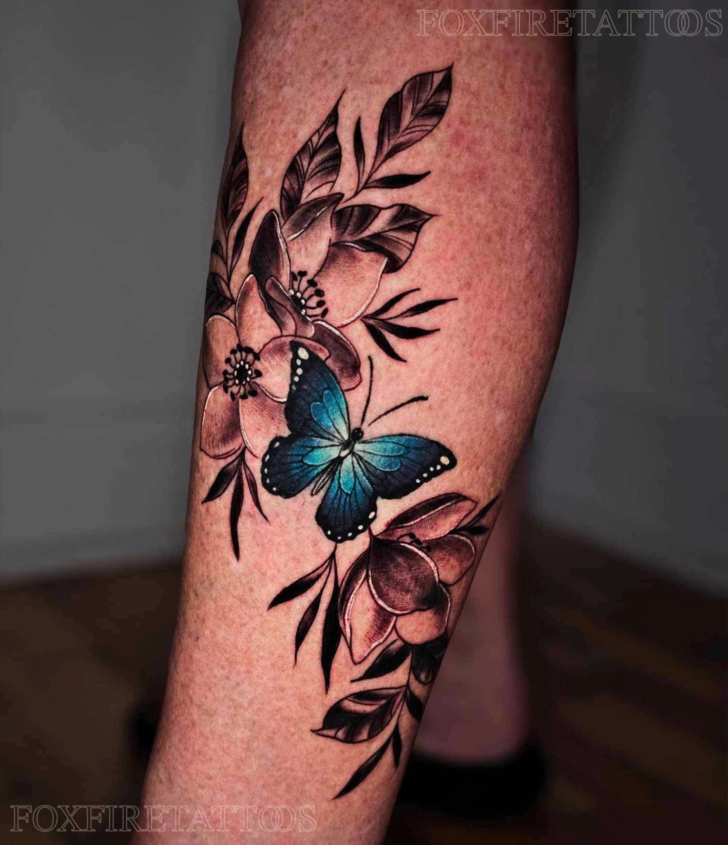 Butterfly and flowers realism tattoo on the forearm by Lindsey Chevalier - KCMO TATTOO ARTIST