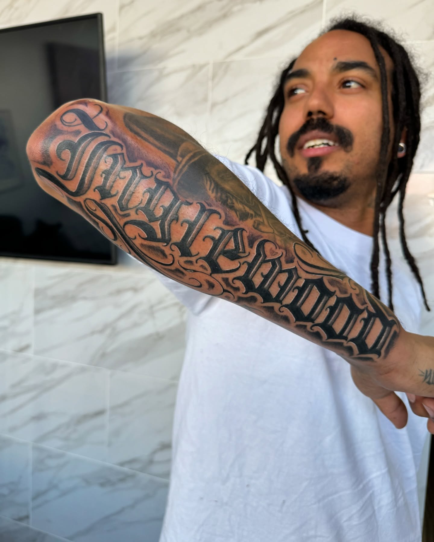 Script lettering lettering script tattoo on the forearm by @samg_tat2s, San Diego, California