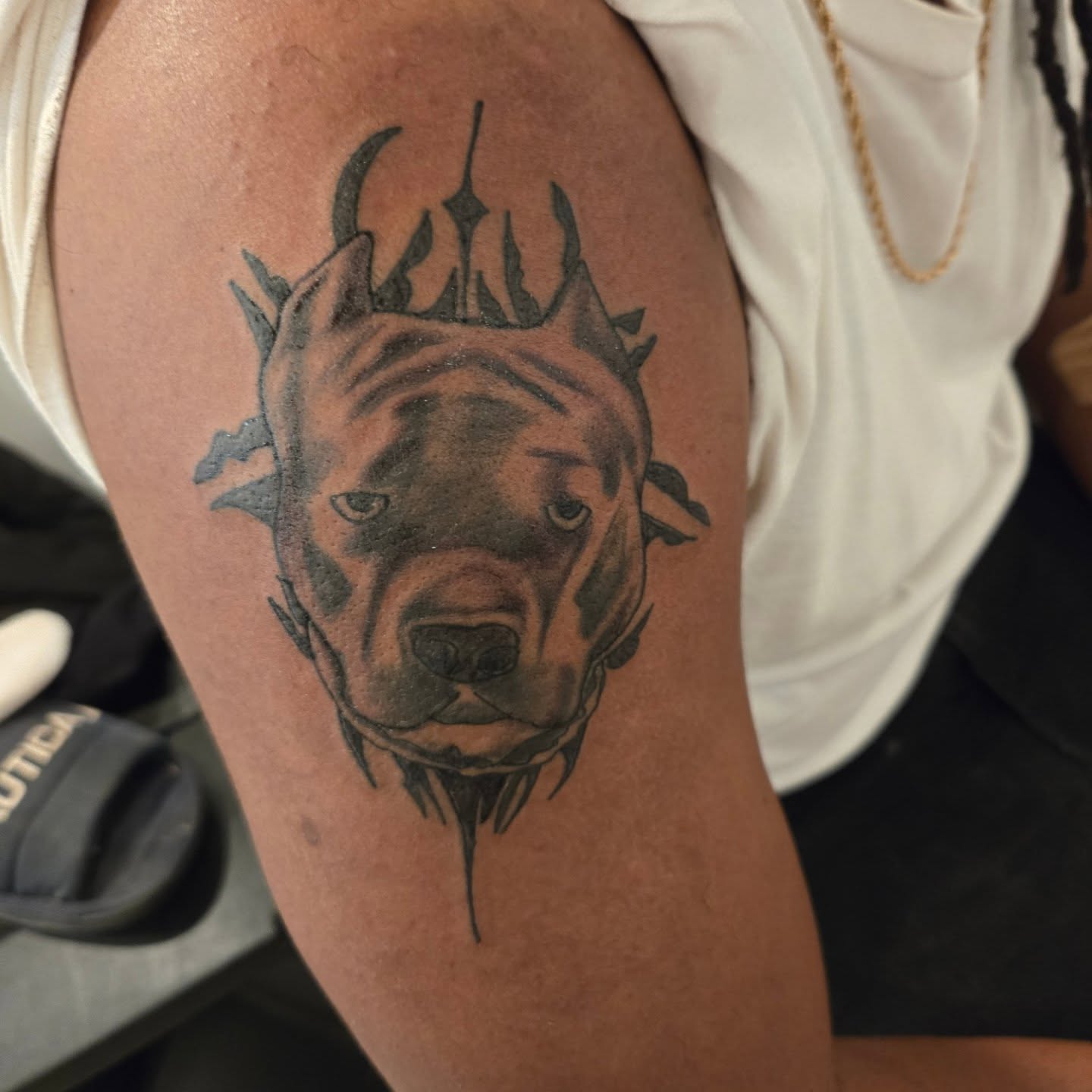 Dog head realism tattoo on the forearm by Trent Johnson