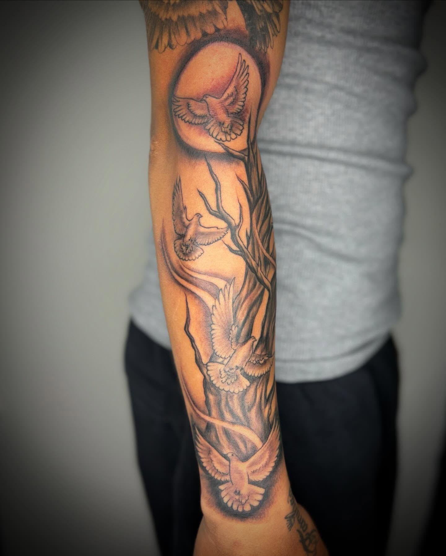 Birds and branches black and grey tattoo on the forearm by Adrian Ram 🇬🇾🇵🇭