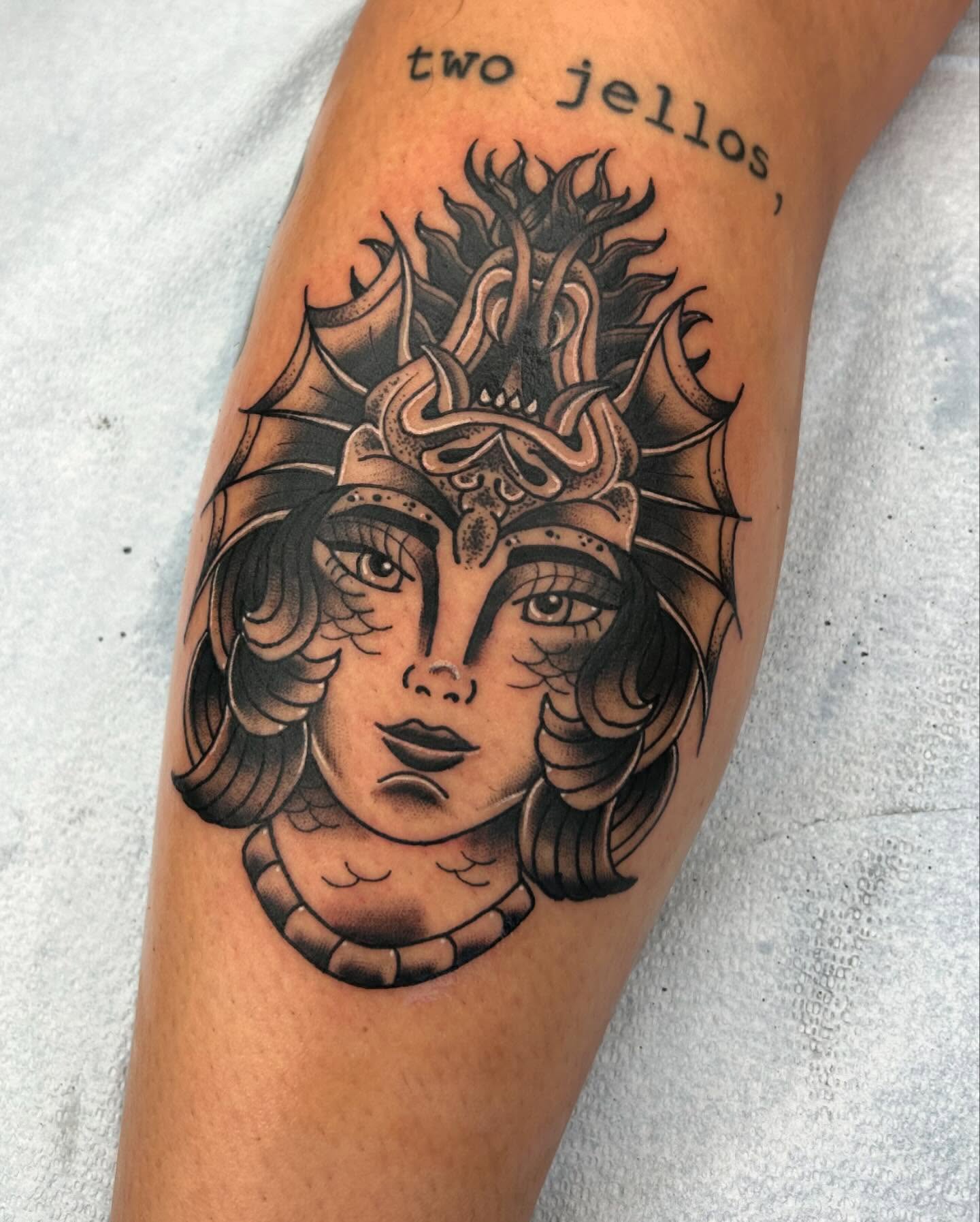 Woman's face American traditional tattoo on the forearm by Noah Crow