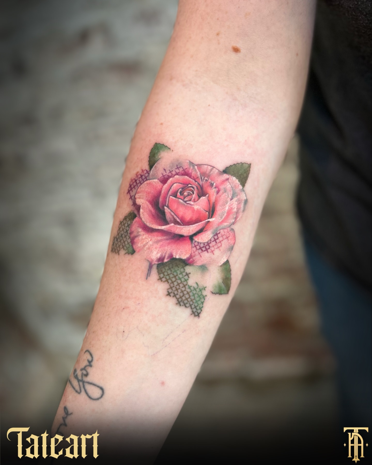 Rose realism tattoo on the forearm by Tate Wortham