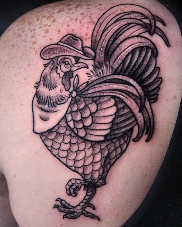 Rooster wearing hat black and grey tattoo on the shoulder by Audrey Luther