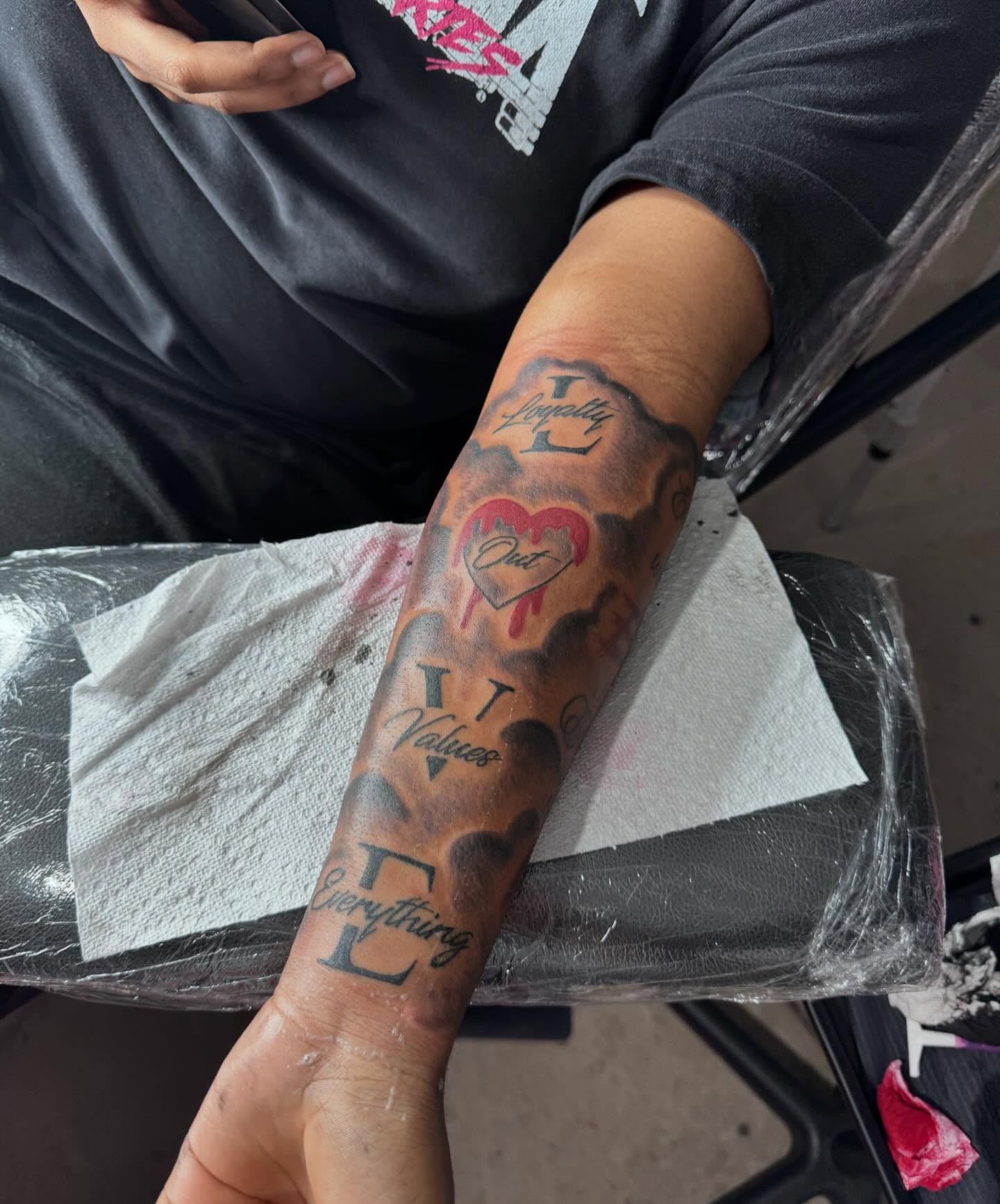 Heart with dripping blood black and grey tattoo on the forearm by Sierra 🩷