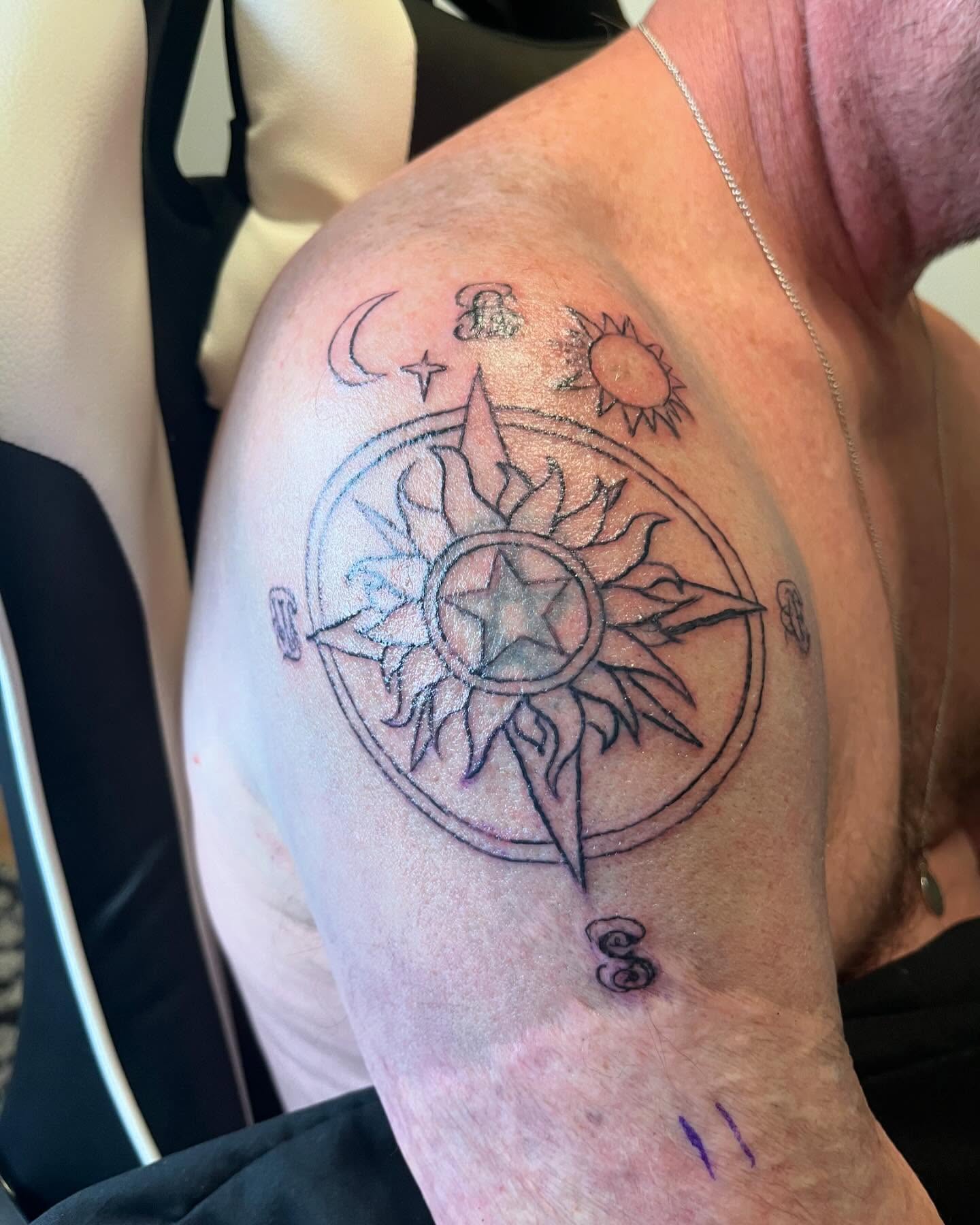 Compass geometric tattoo on the shoulder by Val Maughan