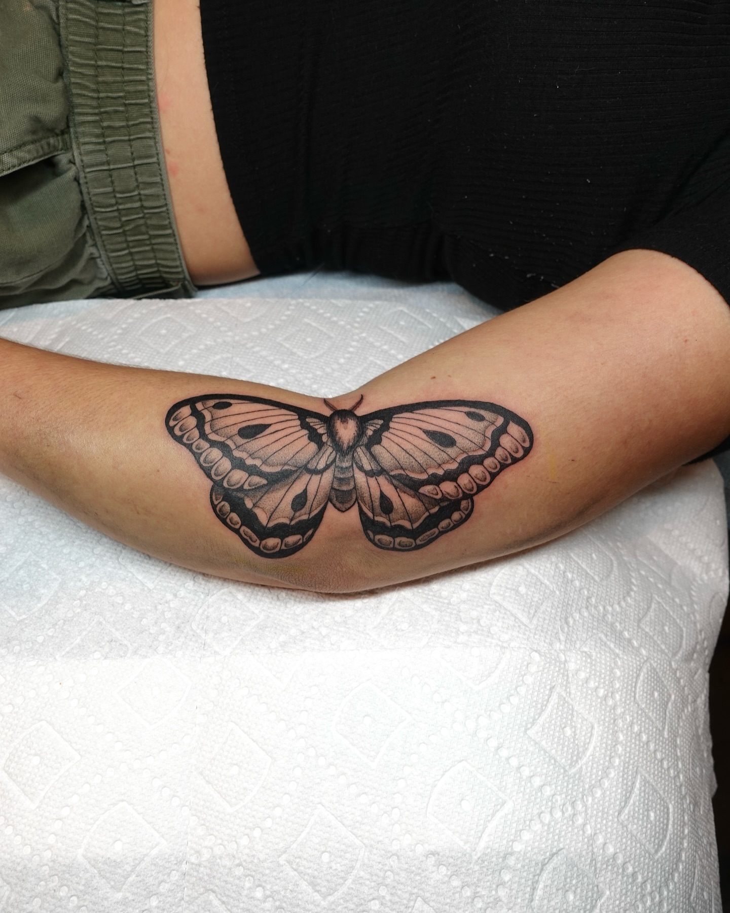 Moth realism tattoo on the forearm by Tat by Brendan