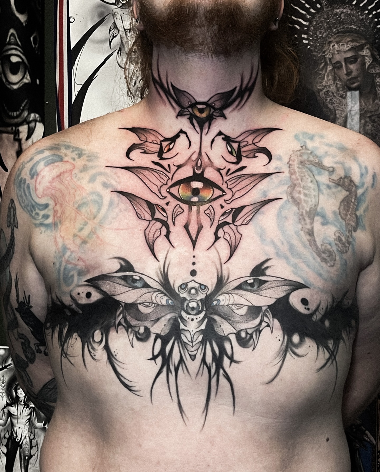 Eye and moth dotwork tattoo on the chest by Ema Fish