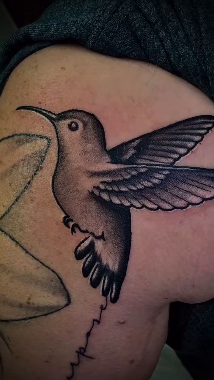 Hummingbird with script fine line tattoo on the shoulder by Luis Cabrera, Cleveland, Ohio