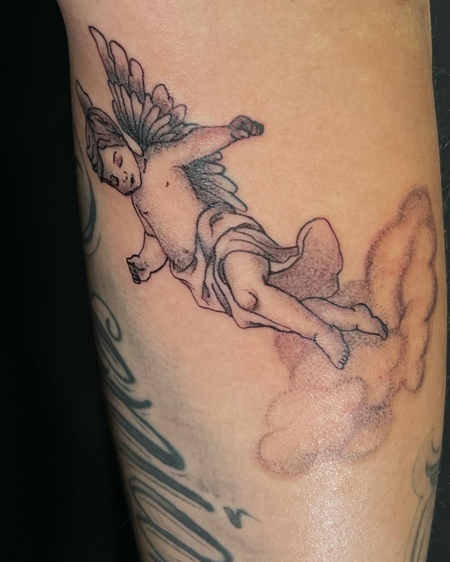 Cherub black and grey tattoo on the forearm by Stefany🩸