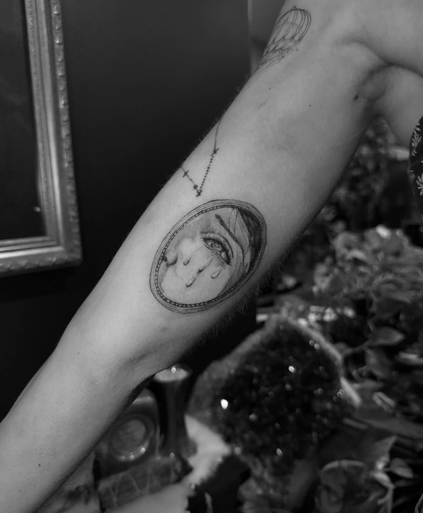 Woman's face realism tattoo on the forearm by chloe🗡️🖤🦇🩸