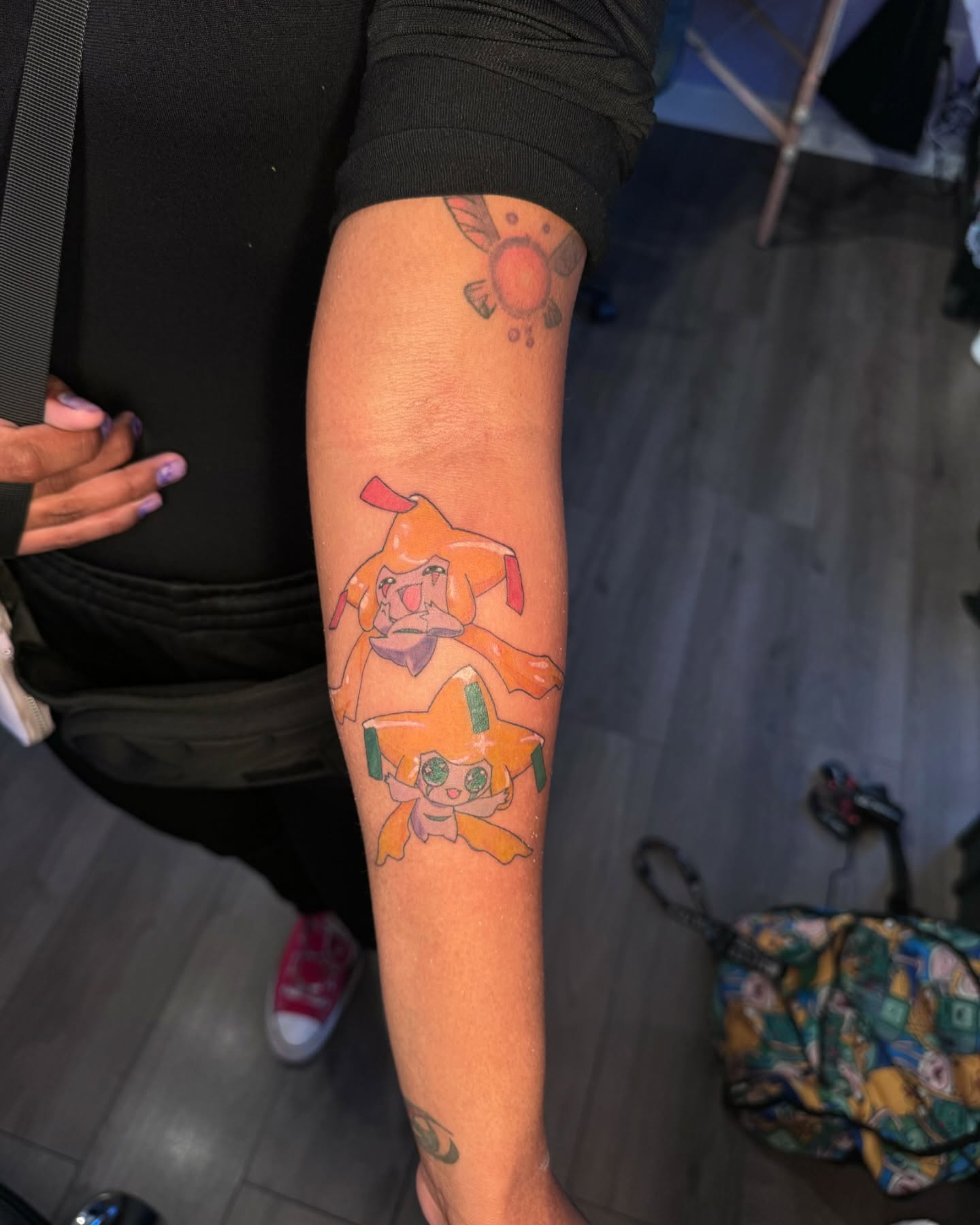 Animal and character anime tattoo on the forearm by Honey