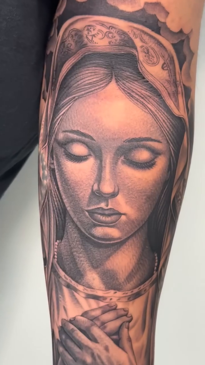 Virgin Mary with praying hands realism tattoo by Kyle Lopez, Union City, California
