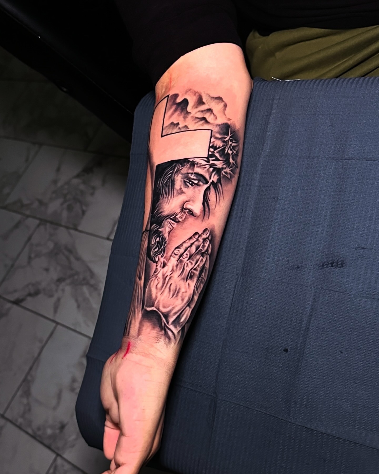 Praying hands realism tattoo on the forearm by Erick @ AZTEC_TATT