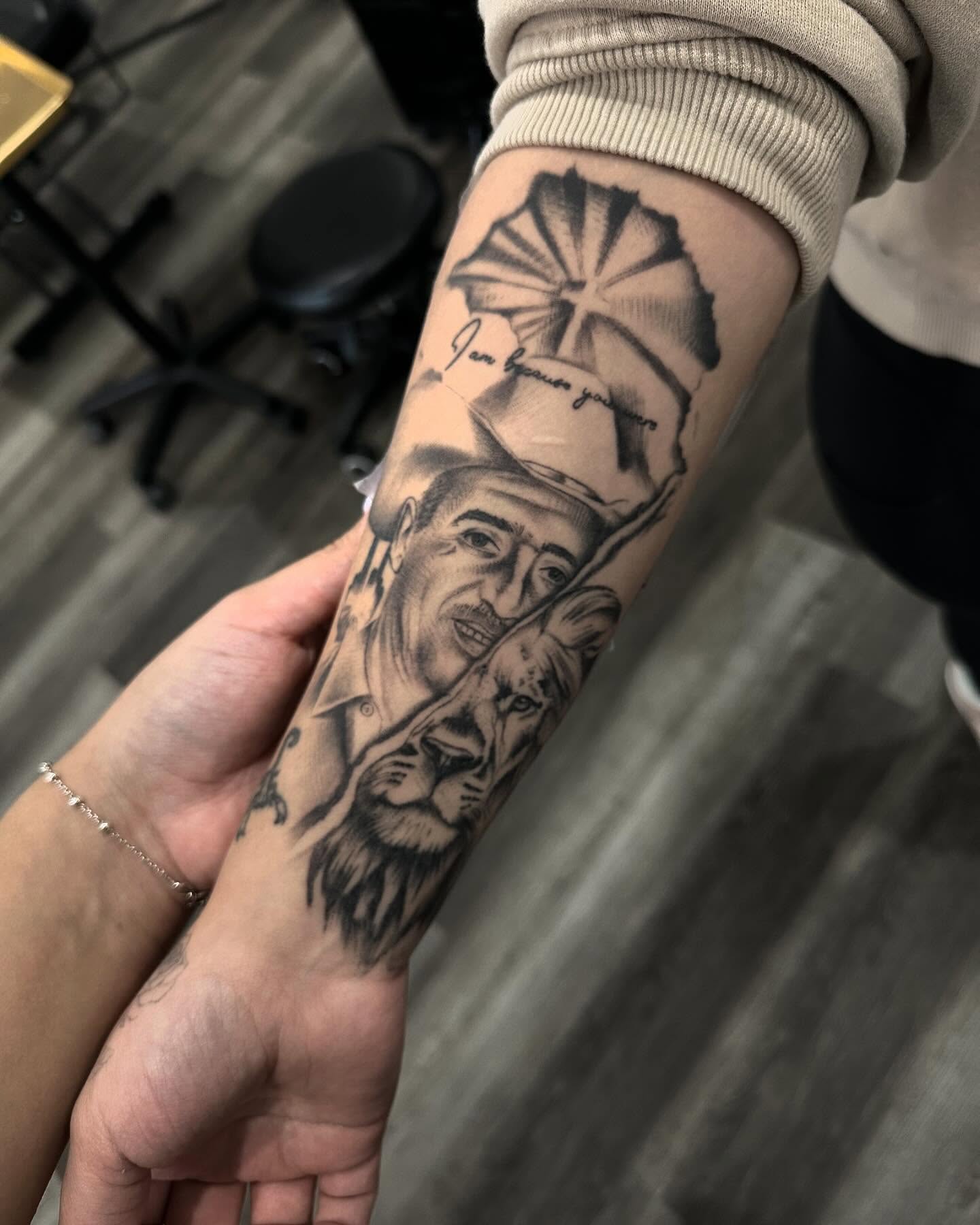 Portrait with lion realism tattoo on the forearm by Las Vegas Tattoo Artist