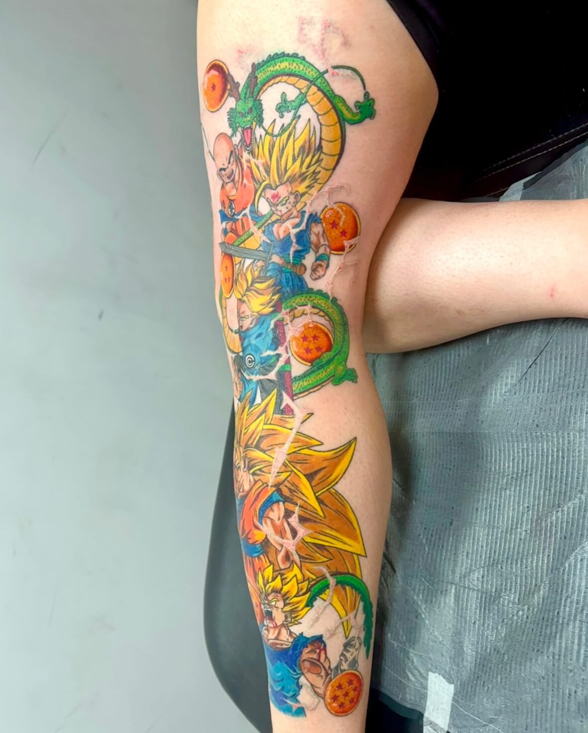 Dragon Ball characters anime tattoo on the forearm by McKenna Chalifoux