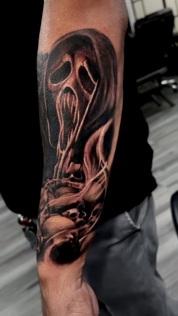 Ghostface mask with skulls dark realism tattoo by Ben Loredo