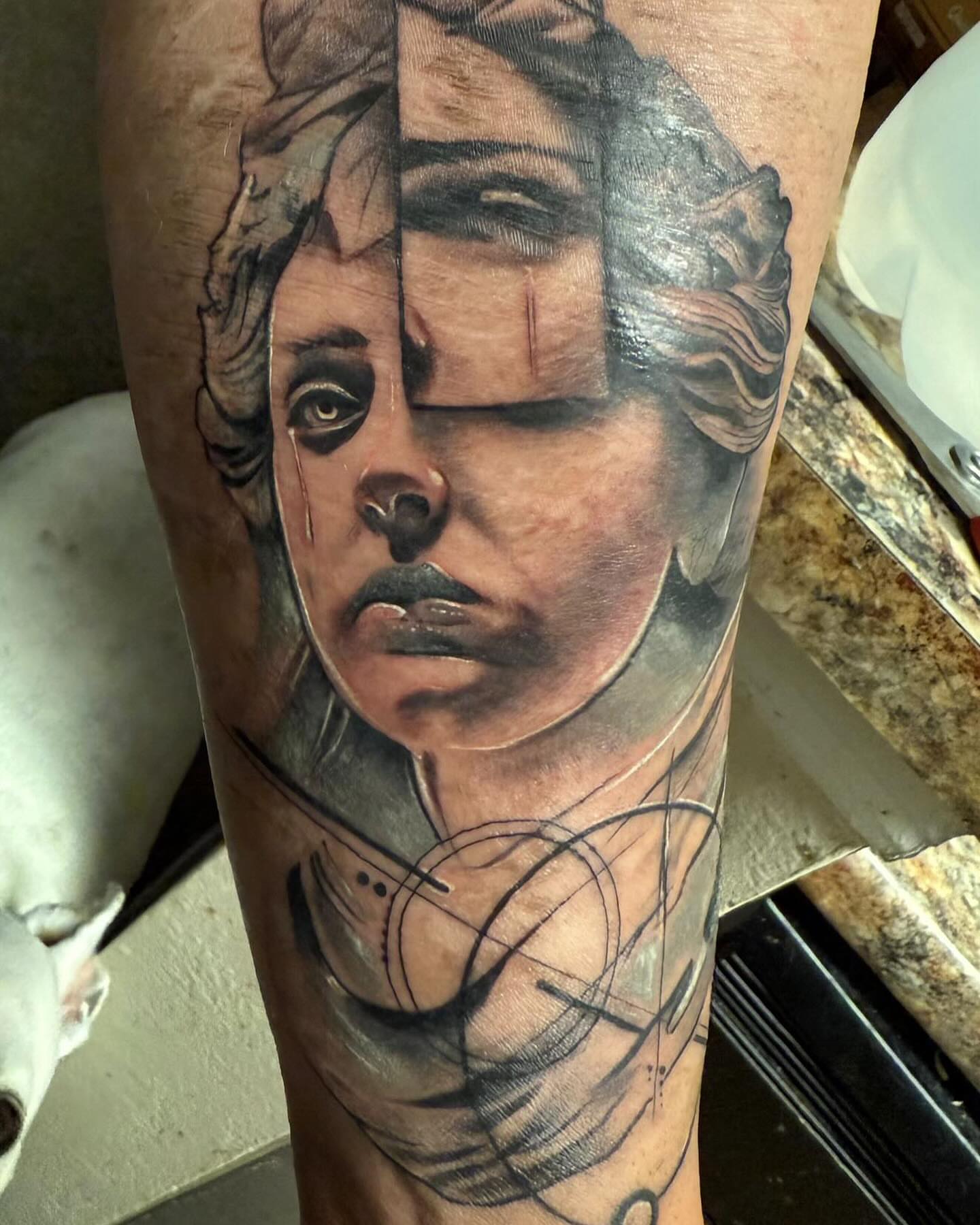 Portrait realism tattoo on the forearm by Kodi Green