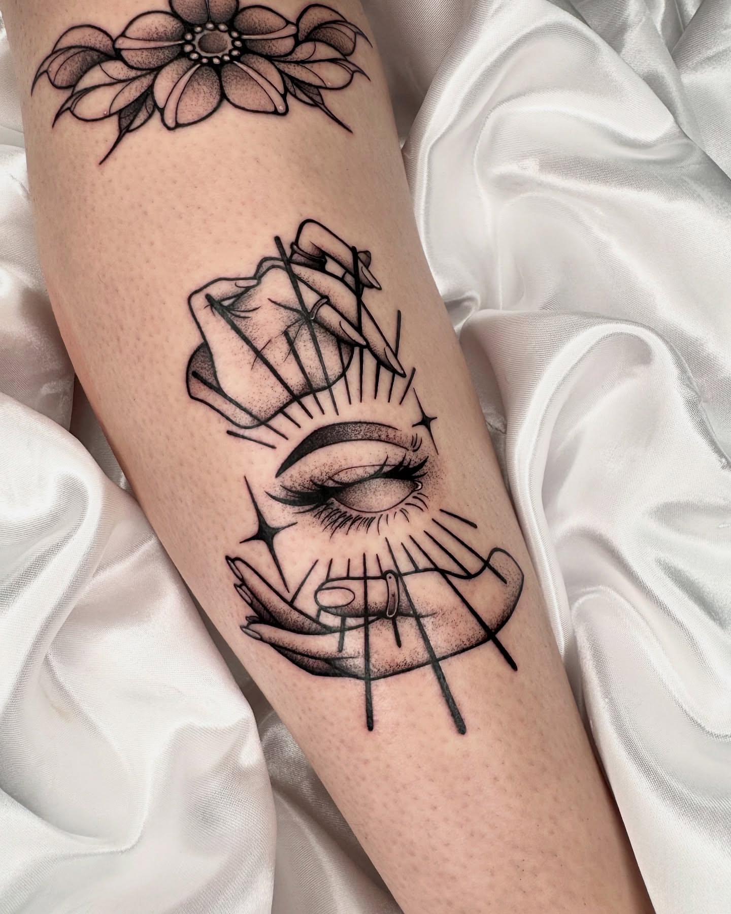 Eye and rose geometric tattoo on the forearm by Gabrieli Folha