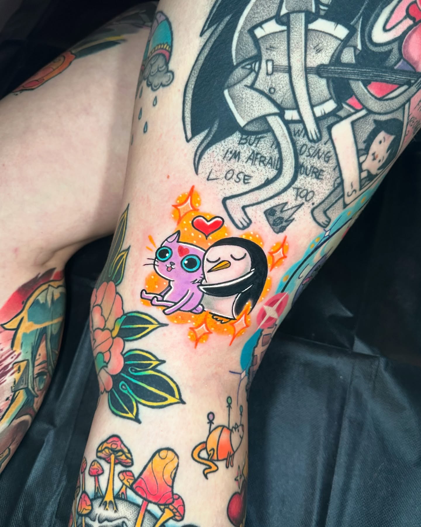 Cat and penguin American traditional tattoo on the forearm by Jeremy Thomas