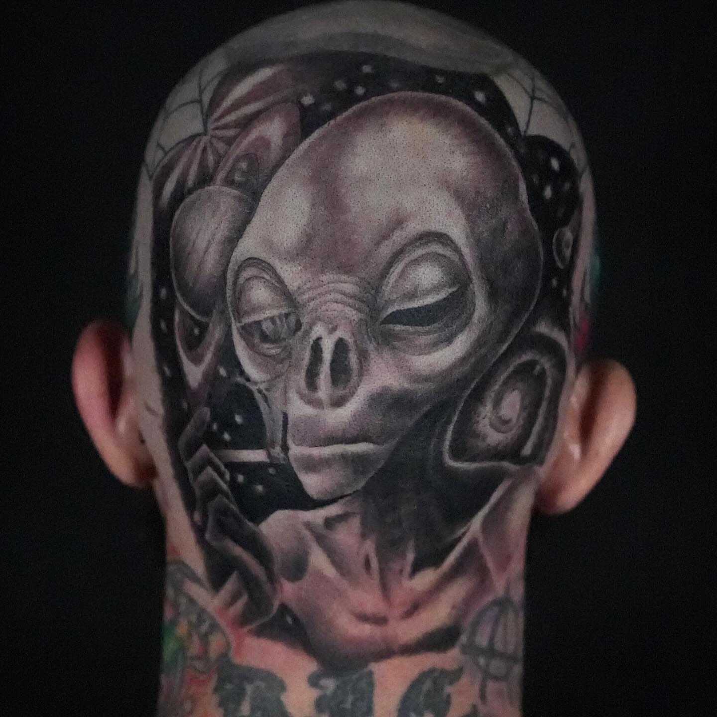 Alien head realism tattoo on the head by Chris Lochbihler