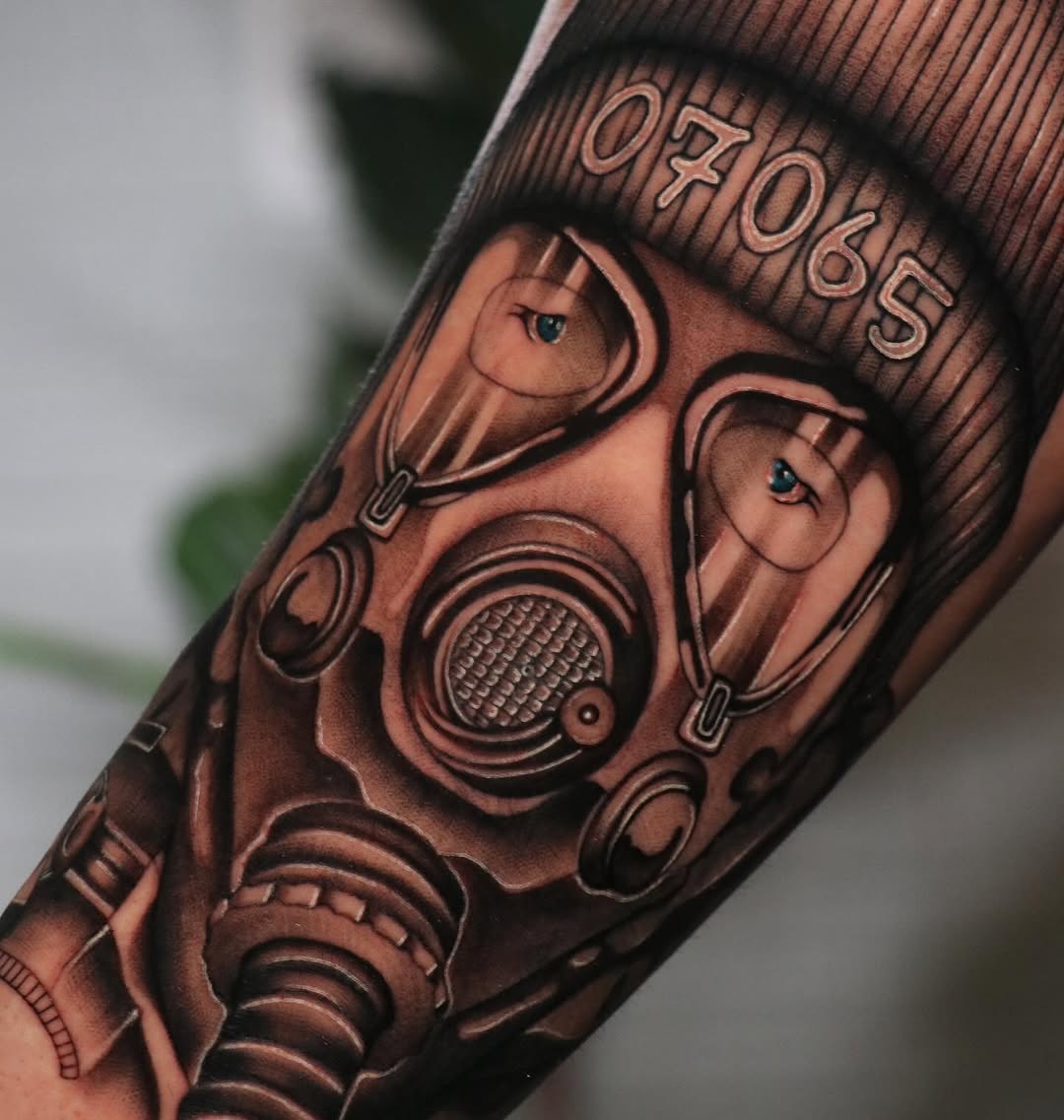 Gas mask with eyes realism tattoo on the forearm by ༺☆༻
