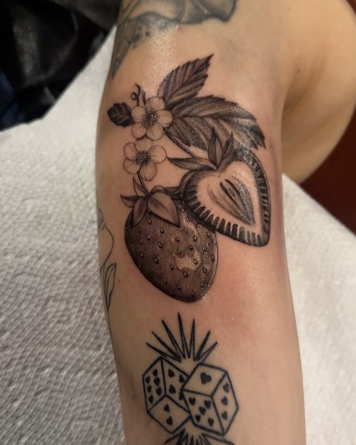 Strawberry and flowers black and grey tattoo on the forearm by jordyn ๐ญ
