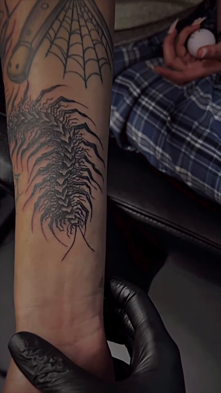 Centipede and spiderweb cyber sigilism tattoo on the forearm by Nikki Ward